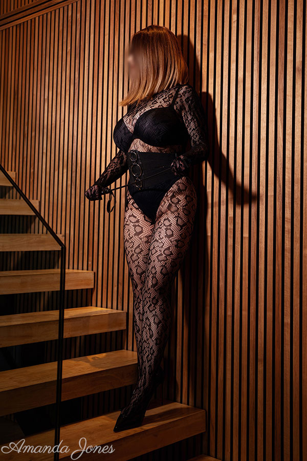 Online Mistress Amanda Jones dressed head to toe in black.